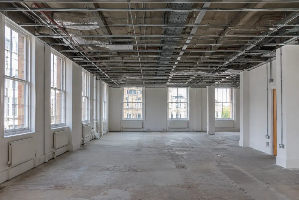 Vacant commercial office with a ceiling service void ahead of refurbishment